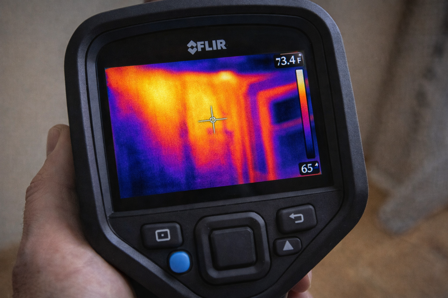 Thermal camera display showing heat map of wall cavity with termite activity
